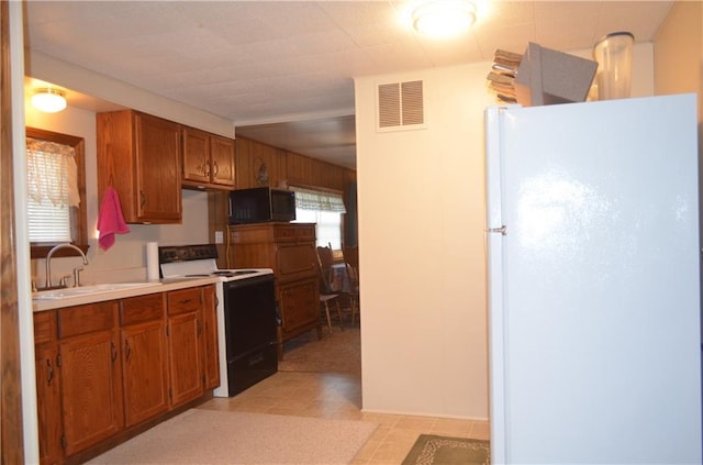 kitchen with sink and white appliances