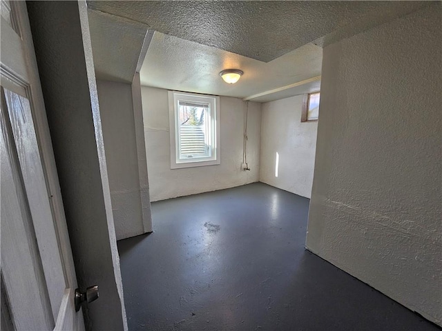 basement featuring a textured ceiling