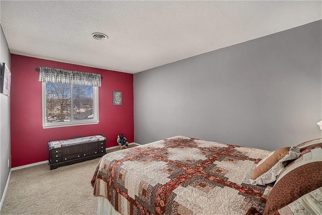 carpeted bedroom with a textured ceiling