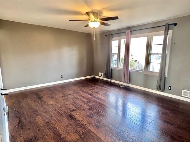 unfurnished room featuring ceiling fan and dark hardwood / wood-style flooring