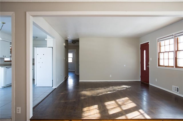 spare room featuring dark hardwood / wood-style flooring