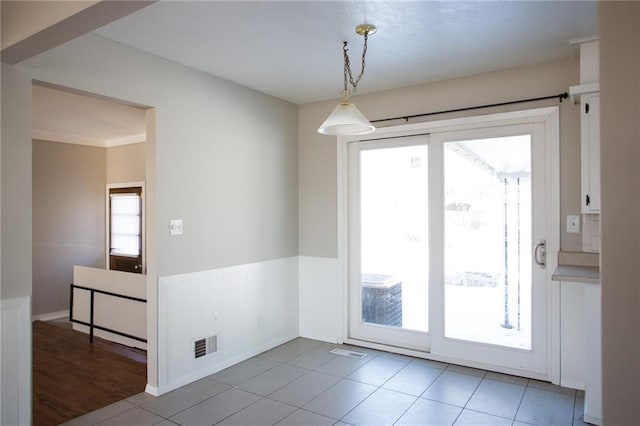 interior space with a healthy amount of sunlight and light tile patterned flooring