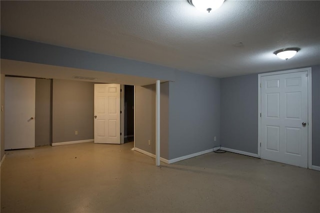 basement with a textured ceiling