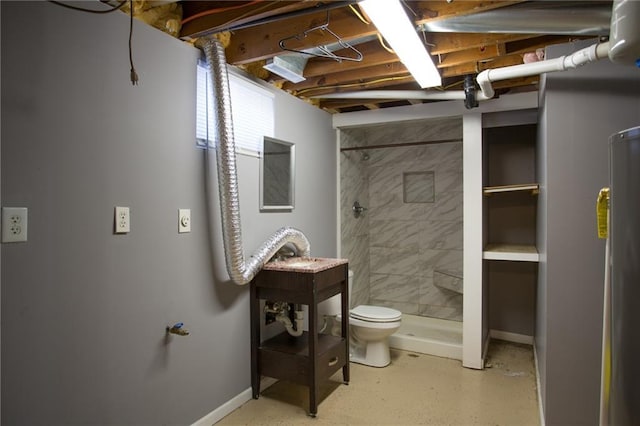 bathroom with toilet and tiled shower