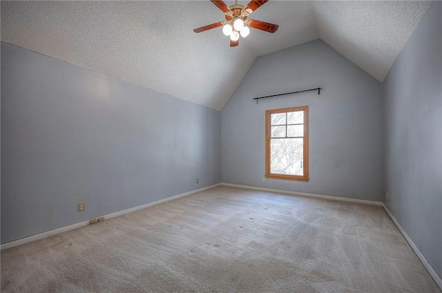 bonus room featuring vaulted ceiling, ceiling fan, light colored carpet, and a textured ceiling