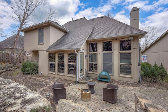 back of property with a patio