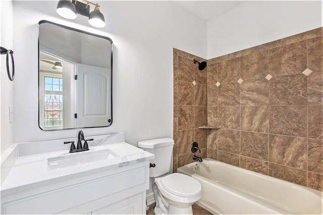 full bathroom with vanity, toilet, and tiled shower / bath combo