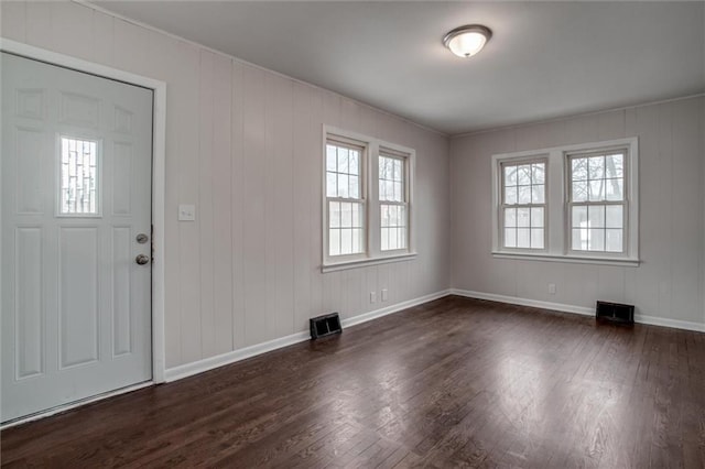 entrance foyer with dark hardwood / wood-style flooring