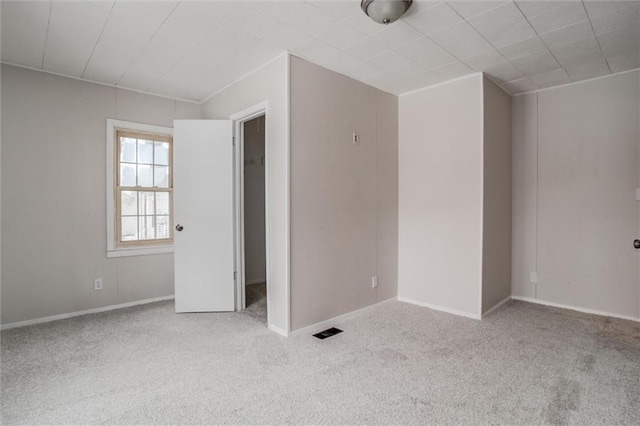 empty room with light colored carpet