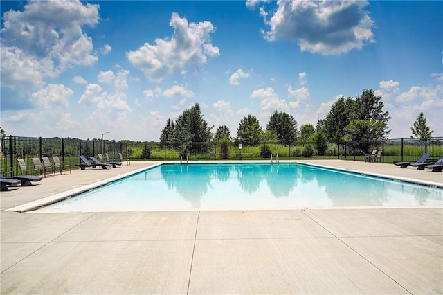 view of swimming pool featuring a patio area