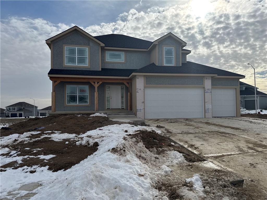 view of front of property with a garage