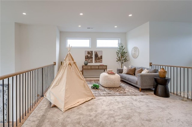 recreation room with carpet floors