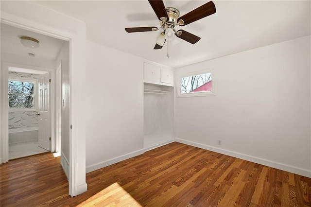 empty room featuring dark hardwood / wood-style floors and ceiling fan