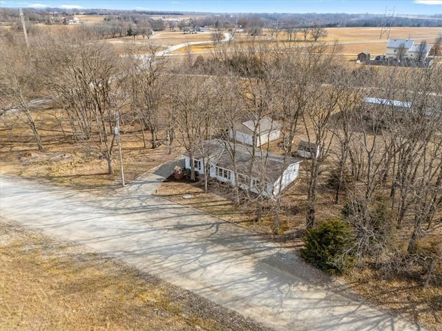 birds eye view of property with a rural view