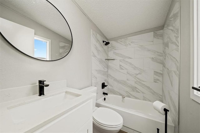 full bathroom with vanity, tiled shower / bath combo, a textured ceiling, and toilet