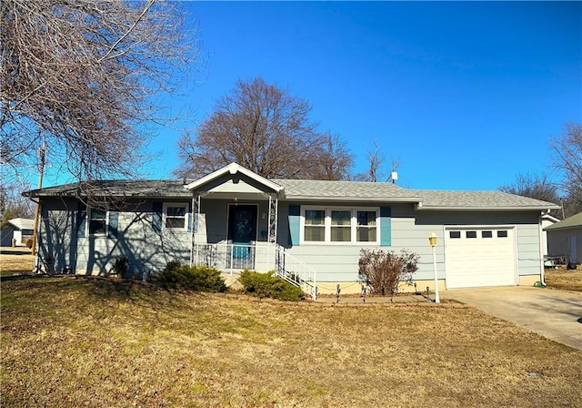 single story home with a garage and a front lawn