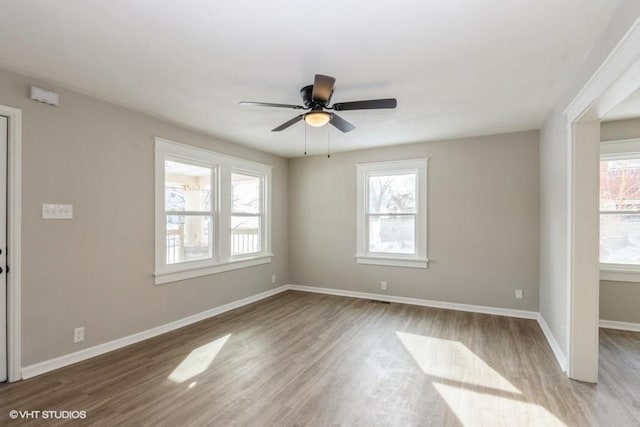 spare room with ceiling fan and light hardwood / wood-style floors