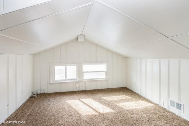 bonus room featuring carpet and lofted ceiling