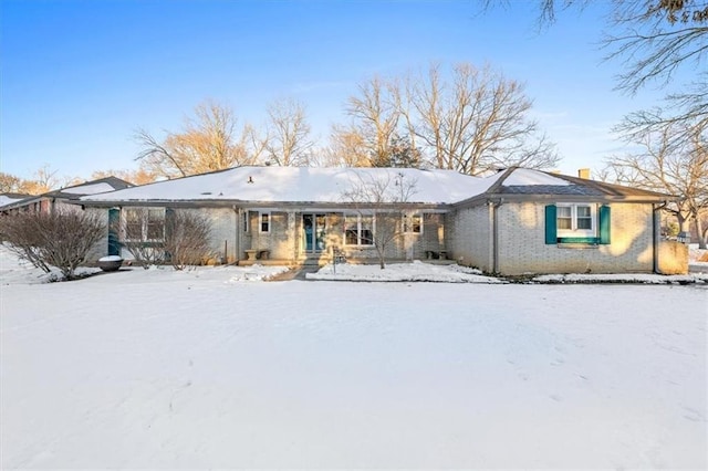 view of snow covered house