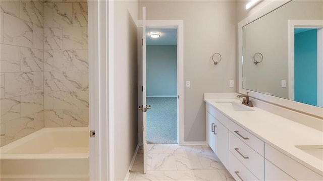 bathroom featuring vanity and tiled shower / bath combo