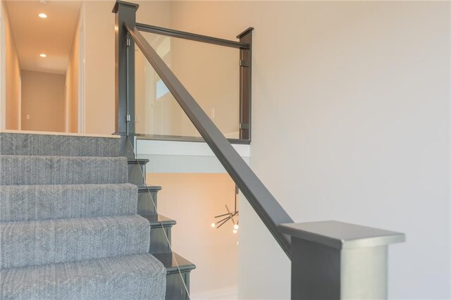 staircase with recessed lighting