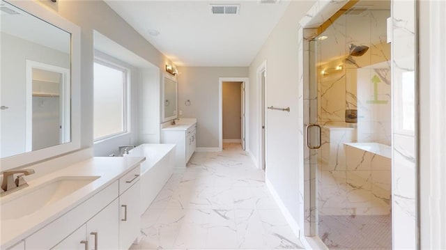 bathroom featuring a marble finish shower, visible vents, a sink, marble finish floor, and two vanities