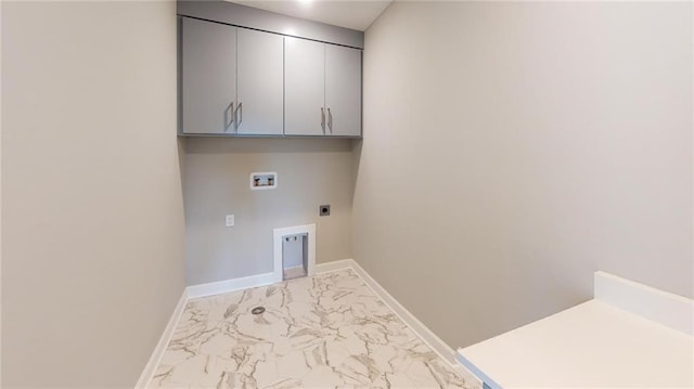 laundry area featuring marble finish floor, hookup for a washing machine, cabinet space, hookup for an electric dryer, and baseboards