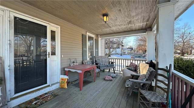 wooden deck featuring covered porch