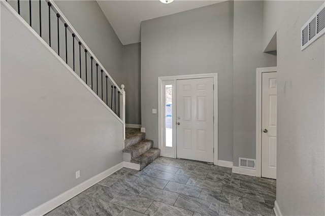 entrance foyer with a towering ceiling