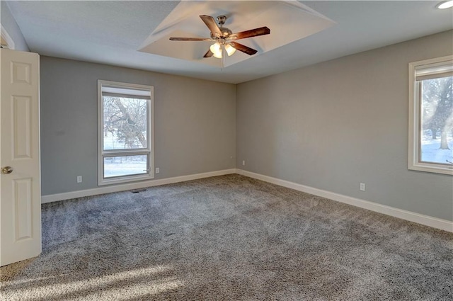 spare room with ceiling fan and carpet flooring