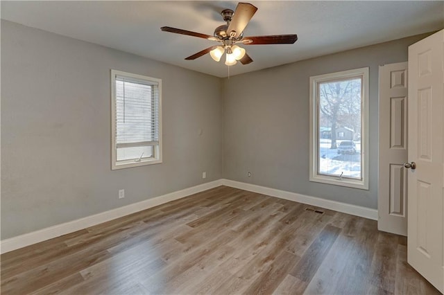 unfurnished room featuring ceiling fan and light hardwood / wood-style floors