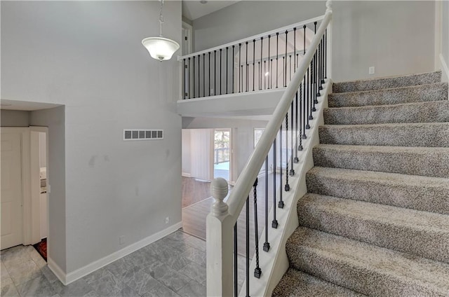 stairs with a towering ceiling