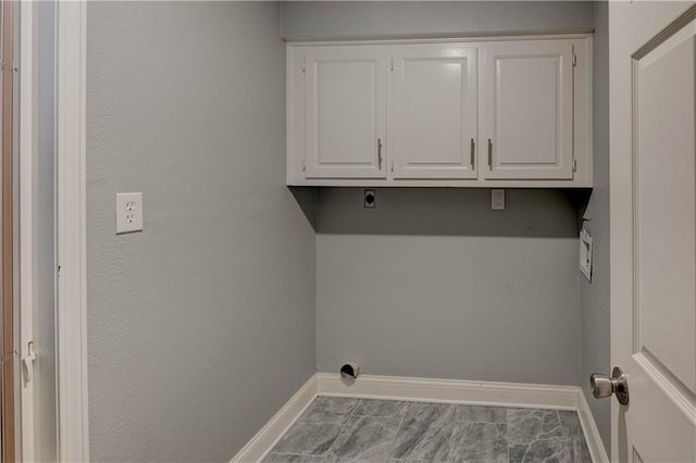 laundry area with cabinets and electric dryer hookup