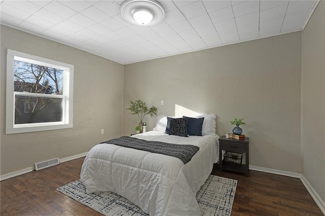 bedroom featuring dark hardwood / wood-style flooring