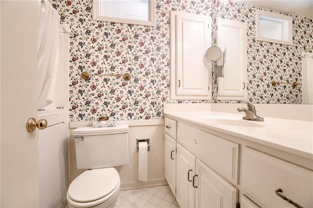 bathroom with toilet, a shower with curtain, tile patterned flooring, and vanity