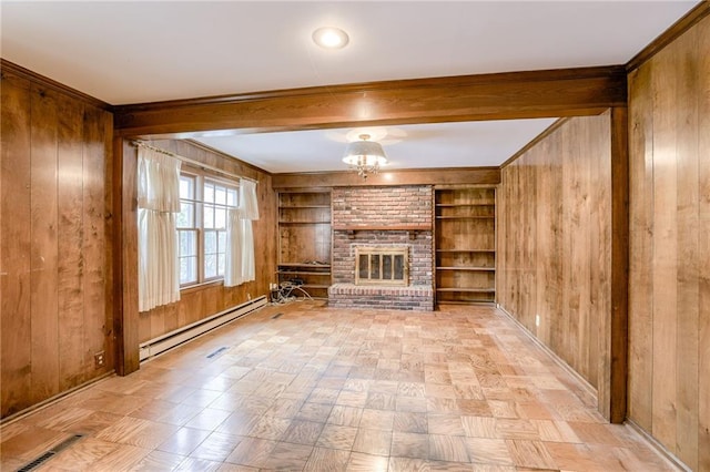 unfurnished living room featuring built in shelves and wooden walls