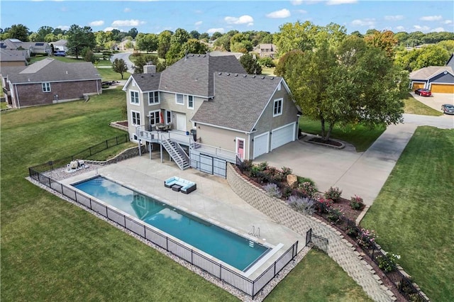 exterior space featuring a yard, a pool side deck, and a patio