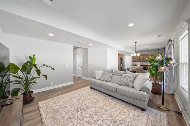 living room with light hardwood / wood-style floors