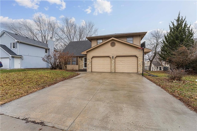 front facade featuring a garage and a front lawn