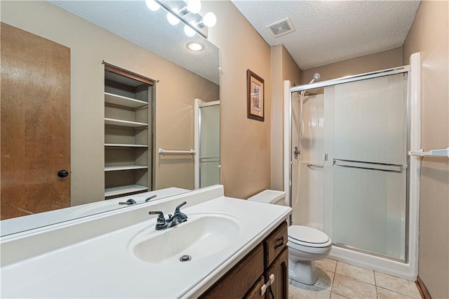 bathroom featuring tile patterned flooring, a textured ceiling, and walk in shower