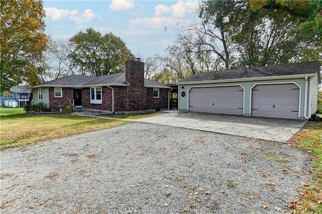 ranch-style house with a garage and a front lawn