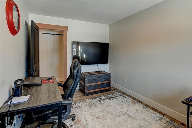 office with wood-type flooring