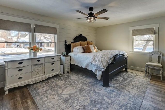 bedroom featuring dark wood-type flooring and ceiling fan