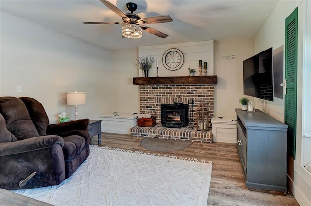 living room with hardwood / wood-style floors and ceiling fan