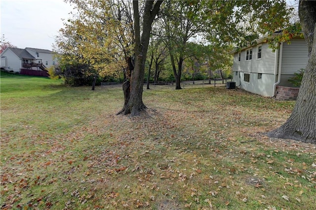 view of yard featuring central air condition unit