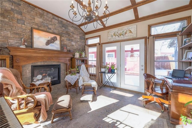 living area featuring french doors, ornamental molding, and a tiled fireplace