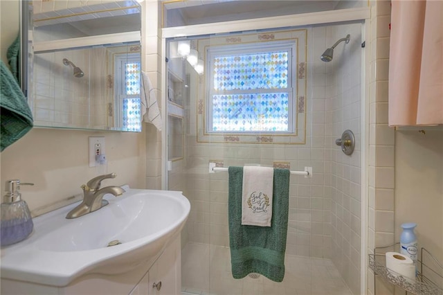 bathroom with vanity and walk in shower