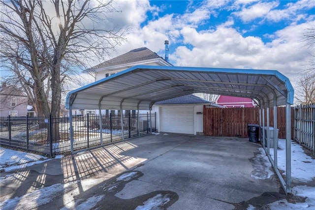 snow covered parking with a carport