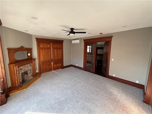 unfurnished living room with ceiling fan, a brick fireplace, and carpet flooring