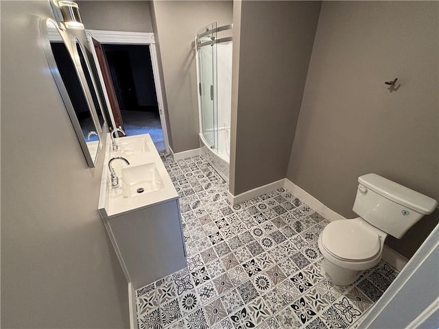 full bathroom featuring vanity, toilet, and shower / bath combination with glass door